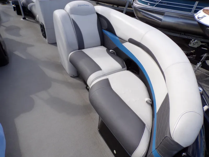 Slide: The Image of 2018 Godfrey Aqua Padio 250 XP boat interior seating with gray and white upholstery. - 7
