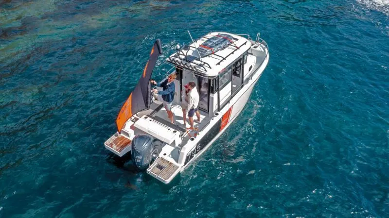 Slide: The Image of 2024 Jeanneau NC 795 Series 2 boat cruising on clear blue water. - 2