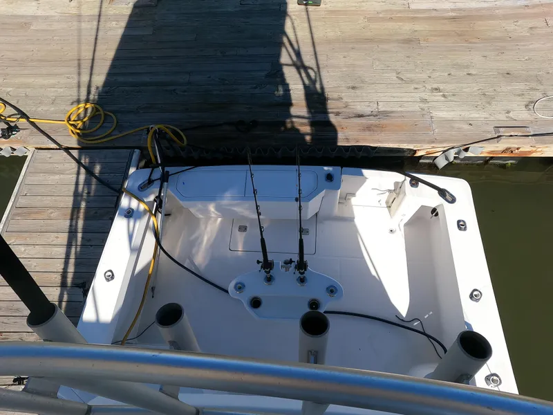 Slide: The Image of 2002 Luhrs 34 Convertible fishing boat cockpit at dock. - 10