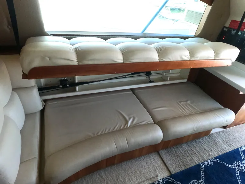 Slide: The Image of Interior seating and convertible bed in a 2002 Luhrs 34 Convertible boat. - 20