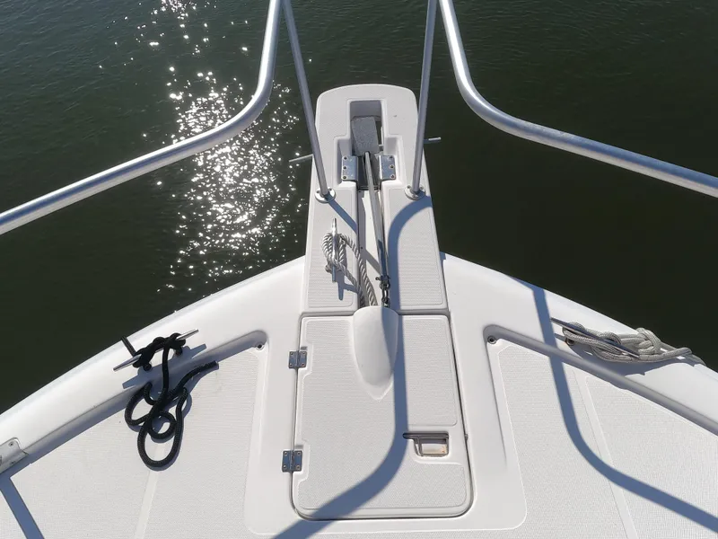Slide: The Image of Bow of 2002 Luhrs 34 Convertible boat with anchor and railings. - 5