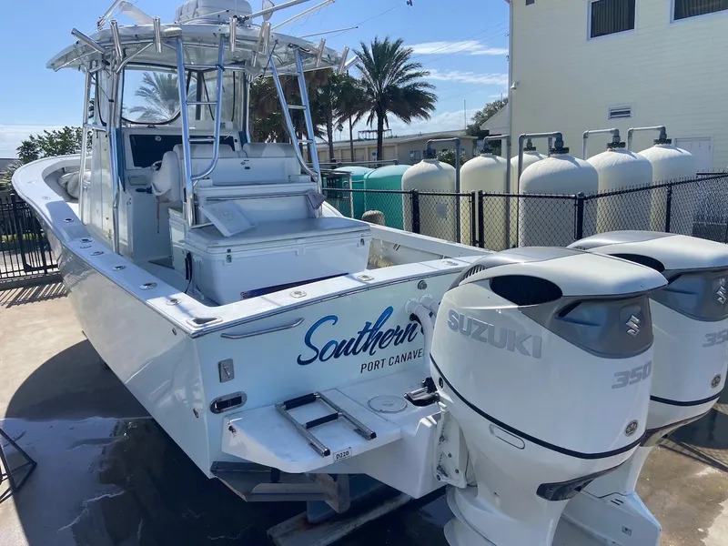 Slide: The Image of 2004 Mirage 32 boat with twin Suzuki 350 engines docked at Port Canaveral. - 10