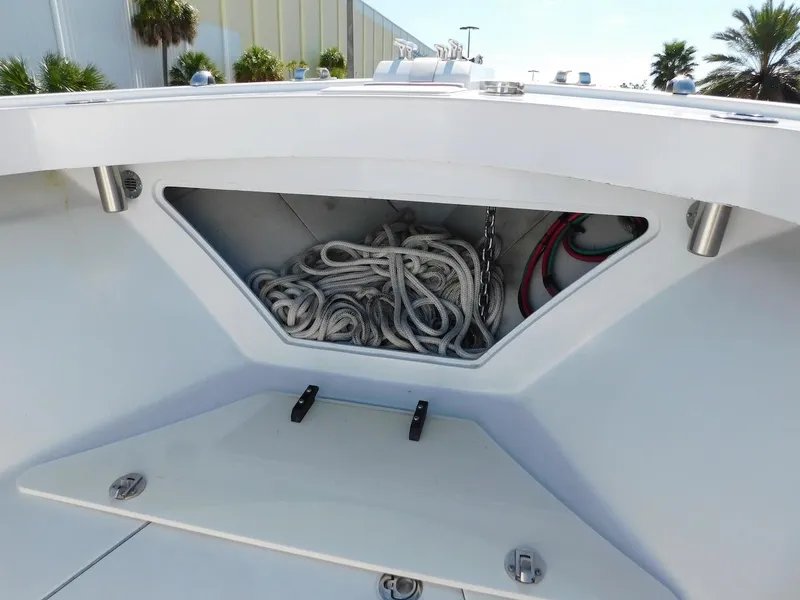 Slide: The Image of Storage compartment of a 2004 Mirage 32 boat with ropes and chains. - 15