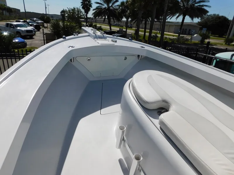 Slide: The Image of 2004 Mirage 32 boat deck with seating and storage compartments. - 17