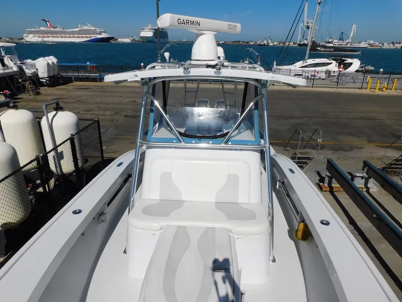 Slide: The Image of 2004 Mirage 32 boat docked at marina with Garmin radar. - 21