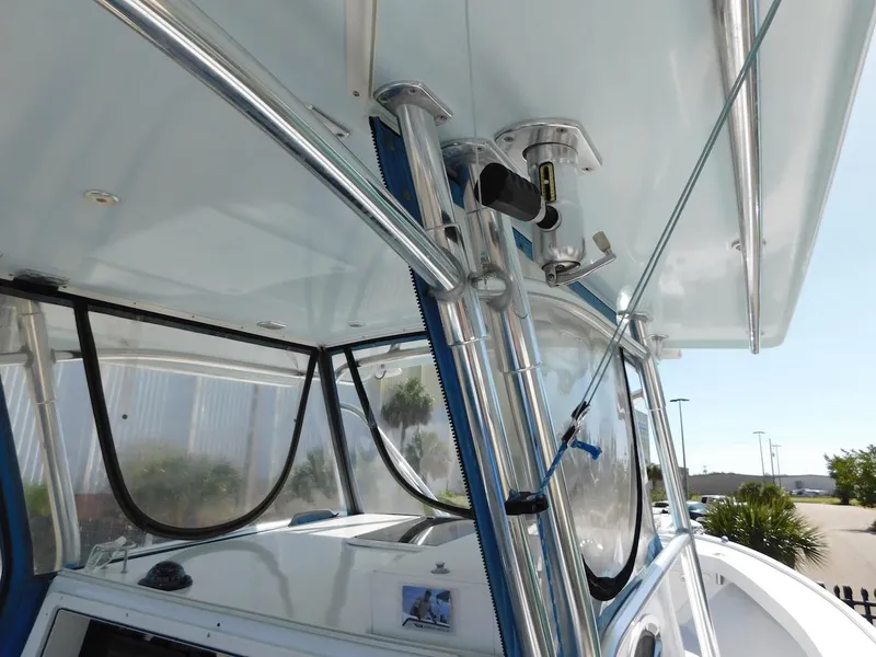 Slide: The Image of 2004 Mirage 32 boat interior with stainless steel frame and clear windows. - 24