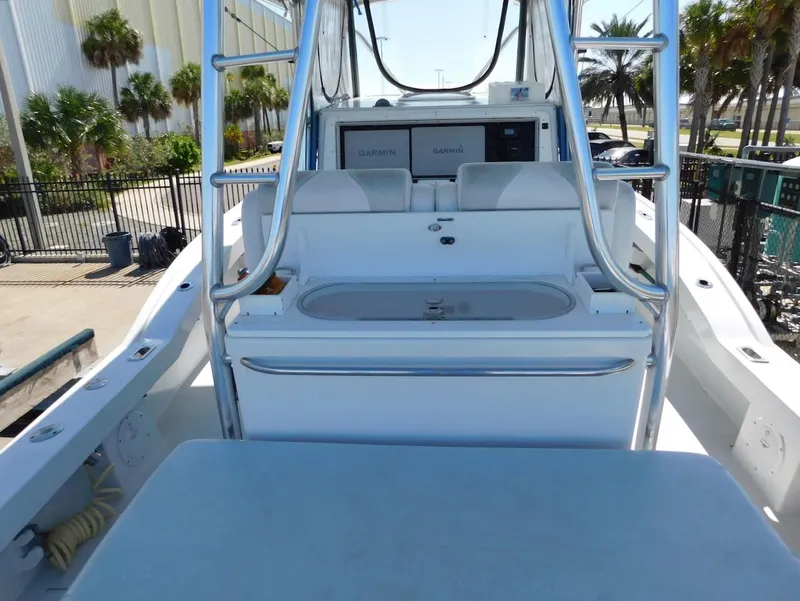 Slide: The Image of 2004 Mirage 32 boat interior with seating and control panel. - 26