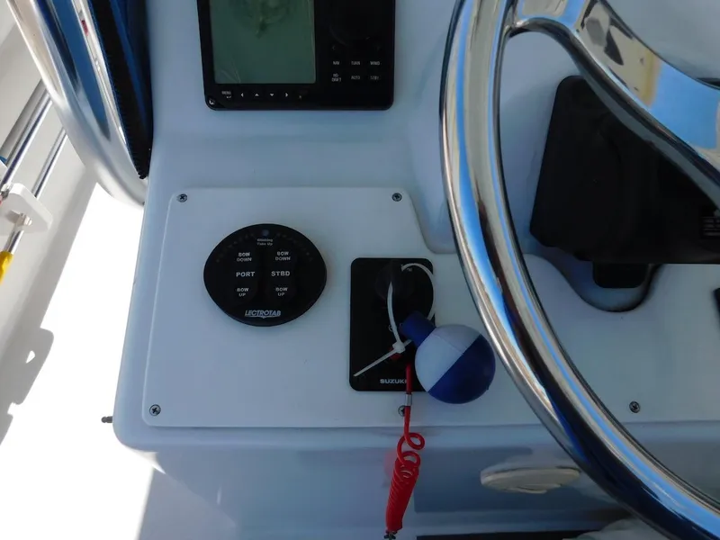 Slide: The Image of Close-up of 2004 Mirage 32 boat control panel and steering wheel. - 28