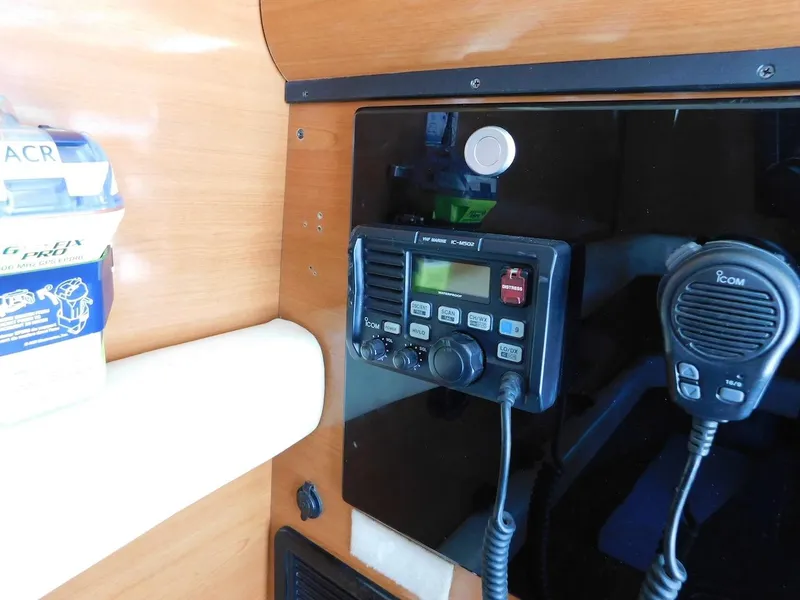 Slide: The Image of Boat radio and communication equipment inside a 2004 Mirage 32. - 42