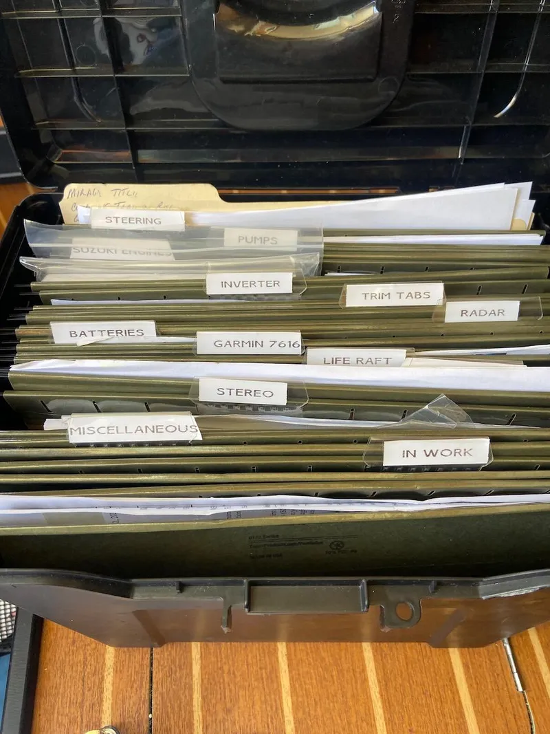 Slide: The Image of Organized file box with labeled folders for boat maintenance, Mirage 32, 2004 model. - 47