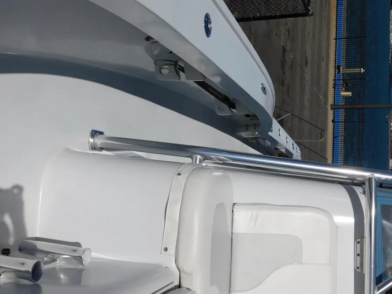 Slide: The Image of 2004 Mirage 32 boat interior with white seating and railing. - 49