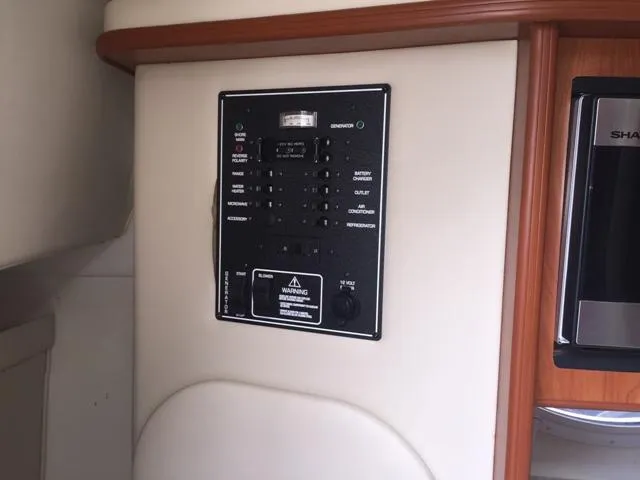 Slide: The Image of Electrical control panel on a 2007 Rinker 270 Express Cruiser boat. - 18