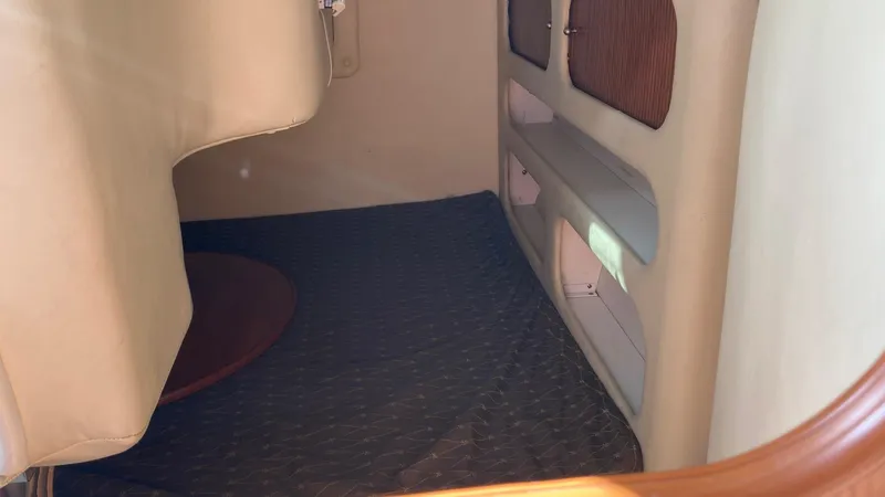 Slide: The Image of Interior cabin of a 2007 Rinker 270 Express Cruiser with storage compartments. - 19