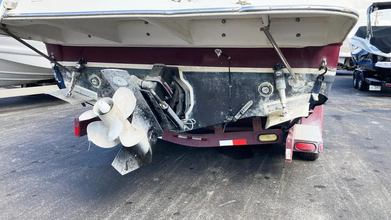 Slide: The Image of 2007 Rinker 270 Express Cruiser stern view with propeller and trailer. - 3