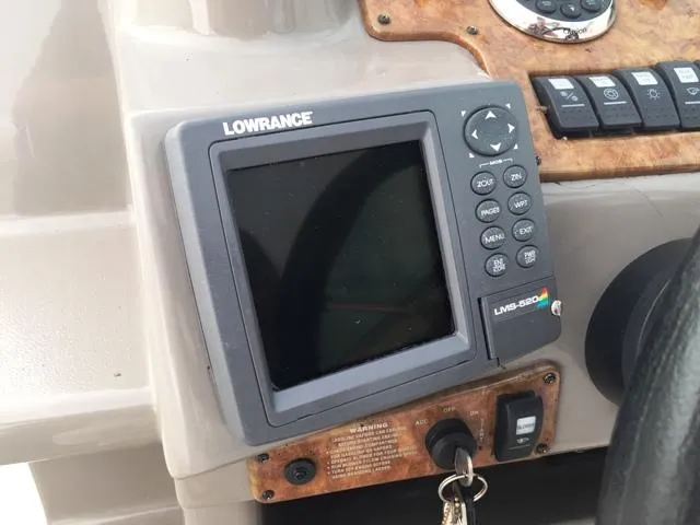Slide: The Image of Lowrance LMS-520C fishfinder on 2007 Rinker 270 Express Cruiser dashboard. - 8
