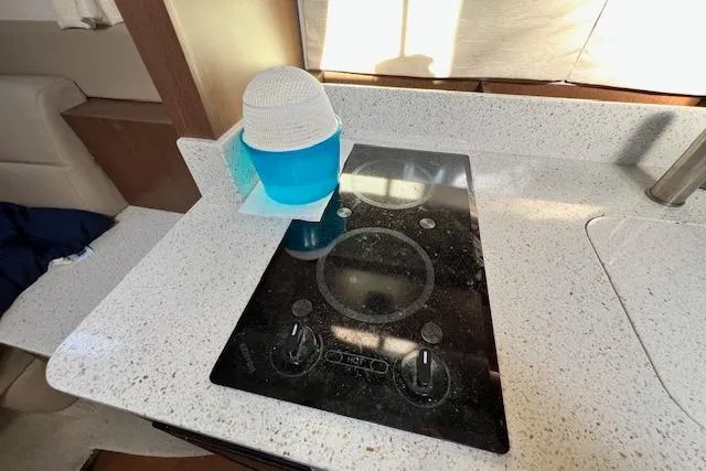 Slide: The Image of Modern kitchen area in 2014 Sea Ray Sundancer 350 yacht with electric cooktop. - 15