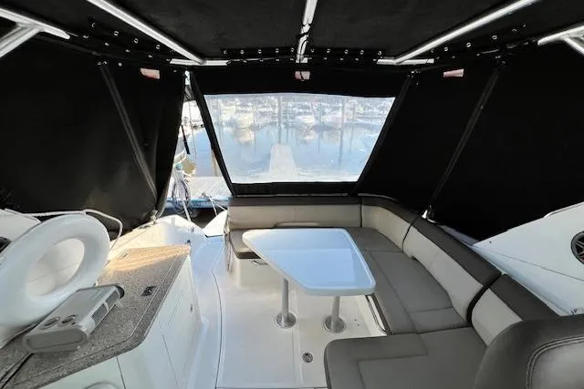 Slide: The Image of Interior view of 2014 Sea Ray Sundancer 350 yacht with seating and table. - 25