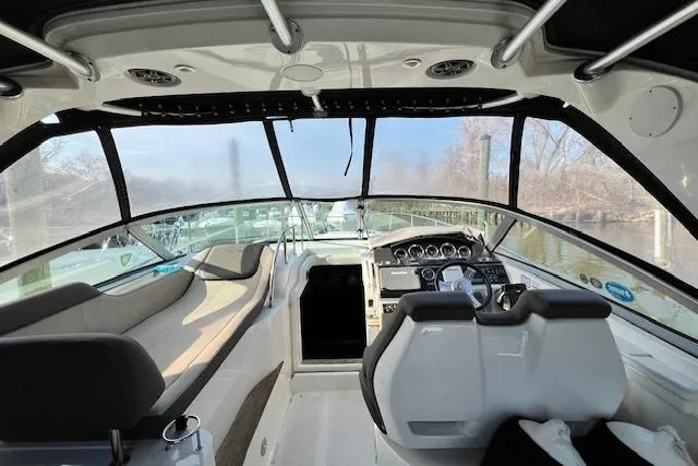 Slide: The Image of 2014 Sea Ray Sundancer 350 cockpit with modern helm and spacious seating. - 30