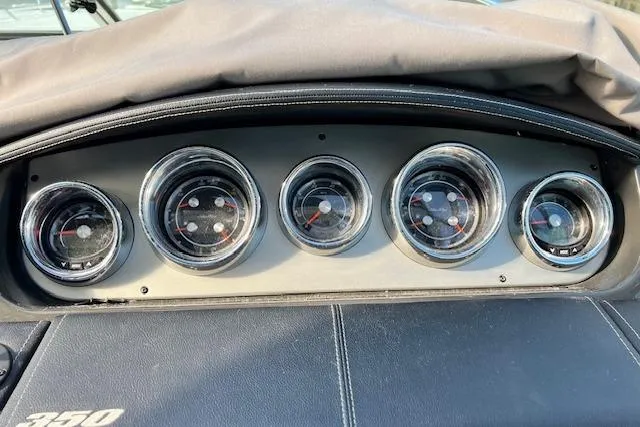 Slide: The Image of Dashboard gauges of a 2014 Sea Ray Sundancer 350 boat. - 8