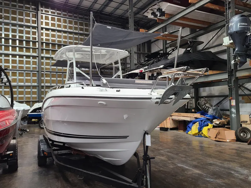 Slide: The Image of 2024 Jeanneau Leader 7.5 WA boat in storage facility. - 1