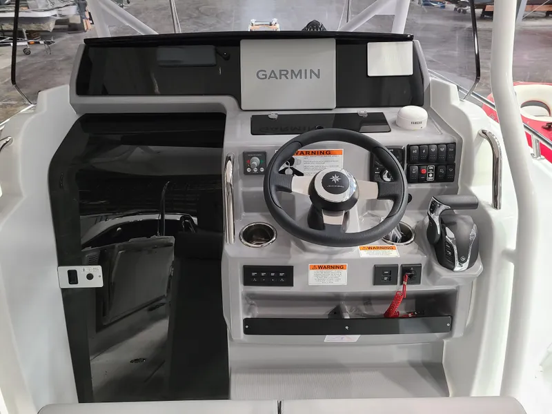 Slide: The Image of 2024 Jeanneau Leader 7.5 WA helm with Garmin navigation system. - 3
