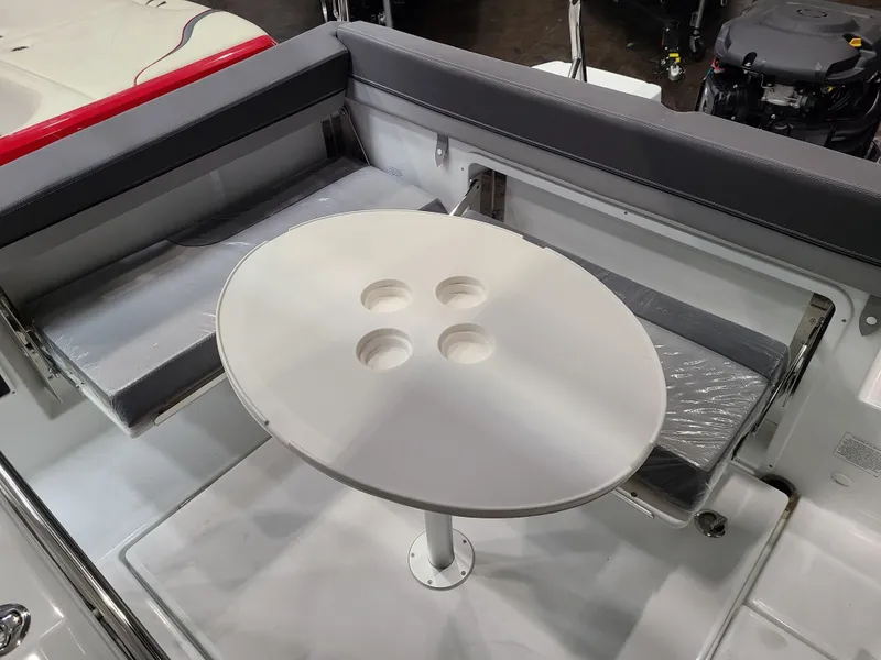 Slide: The Image of 2024 Jeanneau Leader 7.5 WA boat interior with seating and table. - 6