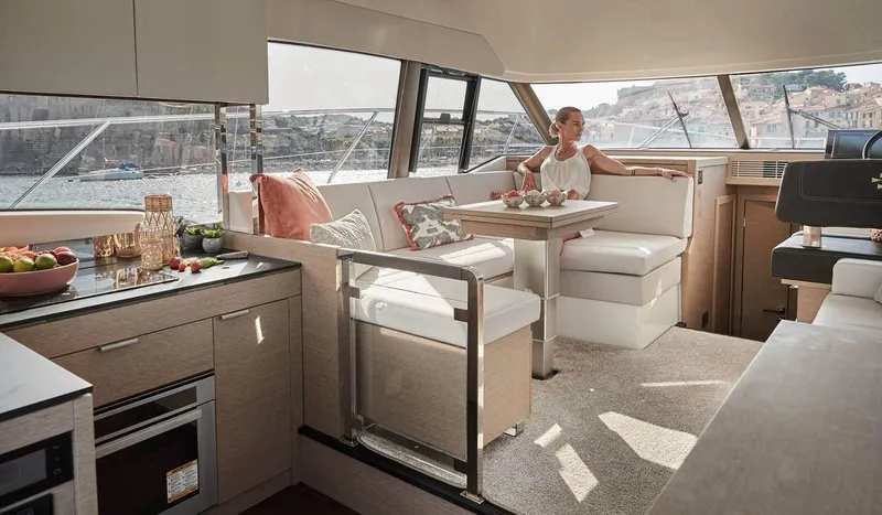 Slide: The Image of Interior of 2024 Prestige 420 Fly yacht with modern kitchen and dining area. - 11