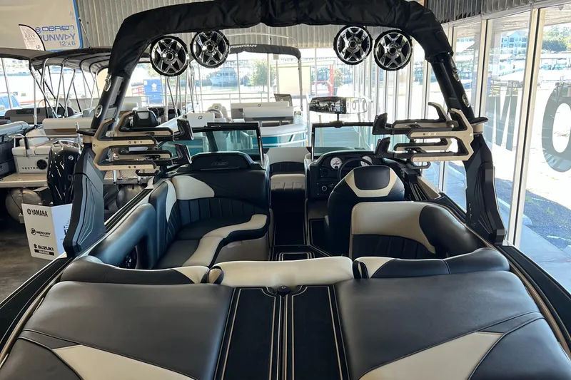 Slide: The Image of 2024 MB F22 Tomcat boat interior with black and white seating and advanced audio system. - 0