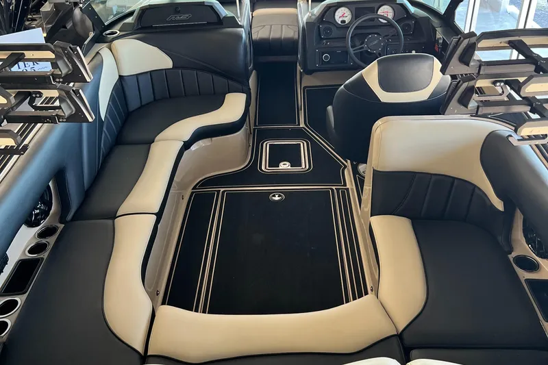 Slide: The Image of Luxurious interior of 2024 MB F22 Tomcat boat with sleek black and beige seating. - 13