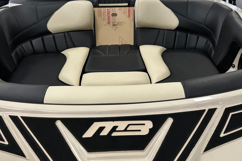 Slide: The Image of 2024 MB F22 Tomcat boat interior with black and white seating. - 16