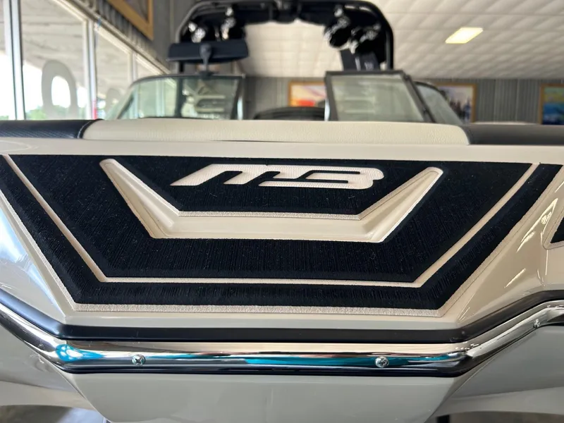 Slide: The Image of 2024 MB F22 Tomcat boat interior with logo detail in showroom. - 20