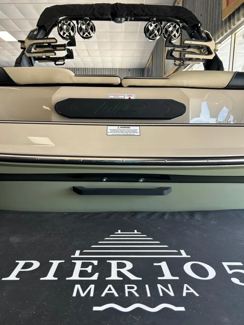 Slide: The Image of 2024 MB F22 Tomcat boat at Pier 105 Marina, featuring sleek design and modern audio system. - 21