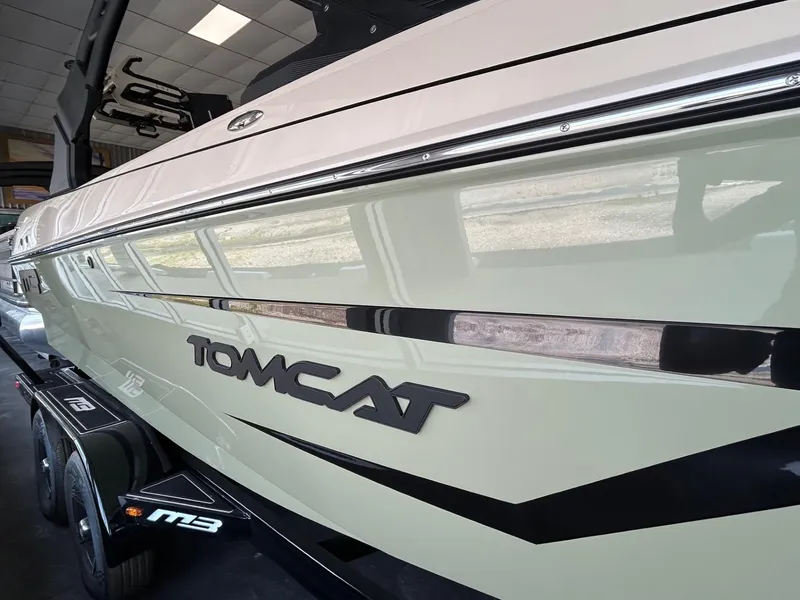 Slide: The Image of 2024 MB F22 Tomcat boat side view with logo and trailer. - 29