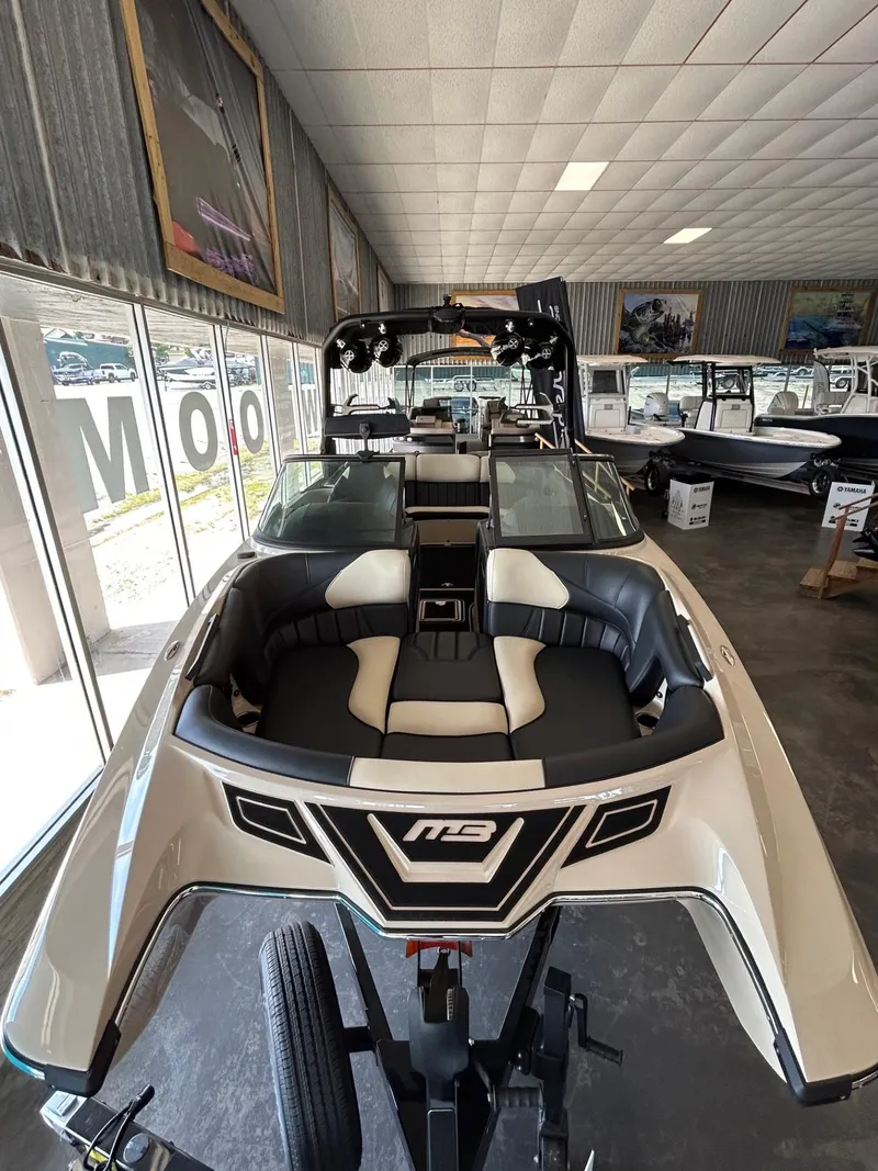 Slide: The Image of 2024 MB F22 Tomcat boat displayed in showroom, featuring sleek design and modern interior. - 30
