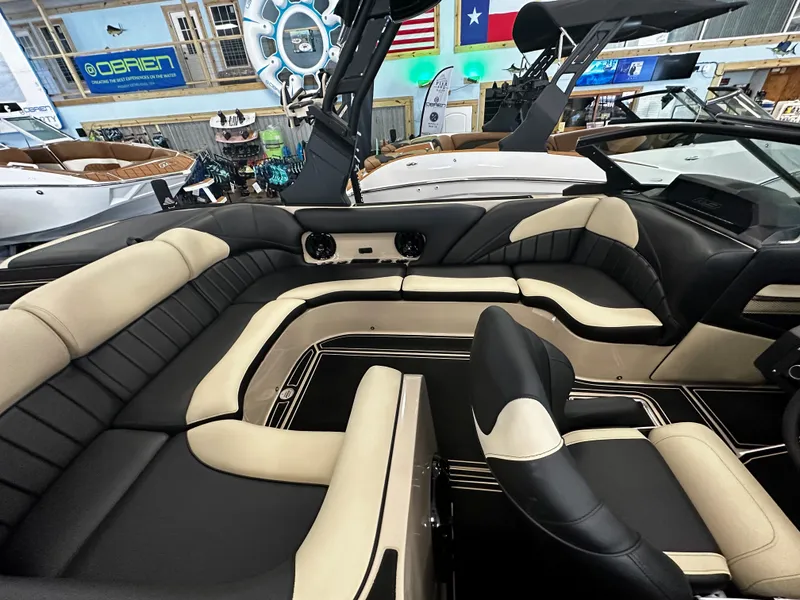 Slide: The Image of Luxurious interior of 2024 MB F22 Tomcat boat with beige and black seating. - 14