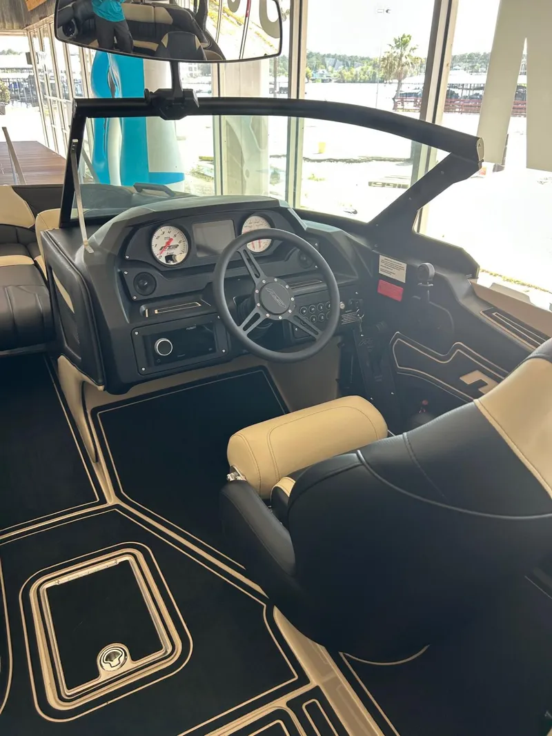 Slide: The Image of 2024 MB F22 Tomcat boat interior with steering wheel and dashboard controls. - 24