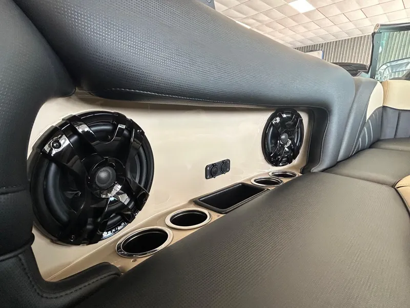 Slide: The Image of 2024 MB F22 Tomcat interior with speakers and cup holders in rear seating area. - 26