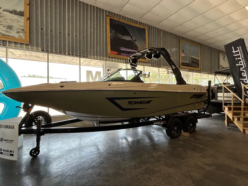 Slide: The Image of 2024 MB F22 Tomcat boat displayed indoors on a trailer. - 27