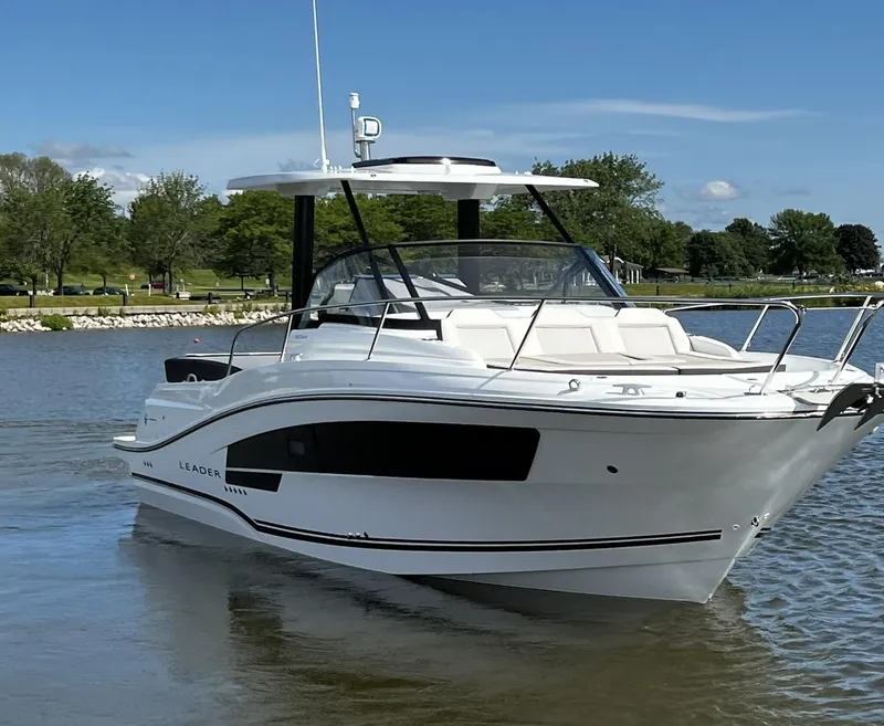 Slide: The Image of 2025 Jeanneau Leader 9.0 WA boat on calm water, clear sky background. - 11