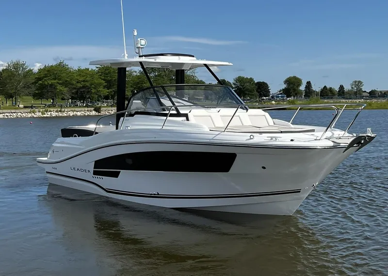 Slide: The Image of 2025 Jeanneau Leader 9.0 WA boat cruising on a calm lake. - 12