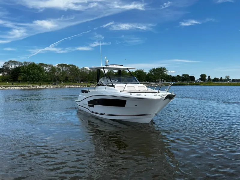 Slide: The Image of 2025 Jeanneau Leader 9.0 WA boat on calm water under blue sky. - 13