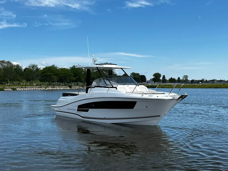 Slide: The Image of 2025 Jeanneau Leader 9.0 WA boat on calm water under blue sky. - 14