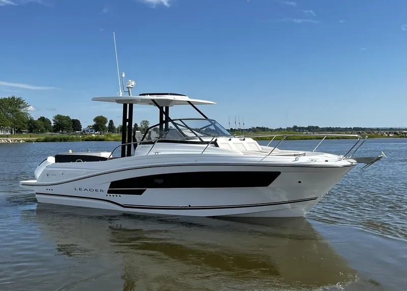 Slide: The Image of 2025 Jeanneau Leader 9.0 WA boat on calm water, side view. - 18