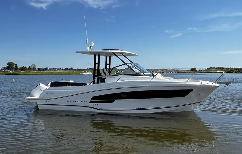 Slide: The Image of 2025 Jeanneau Leader 9.0 WA boat on calm water under clear blue sky. - 20