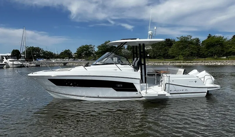 Slide: The Image of 2025 Jeanneau Leader 9.0 WA boat on calm water, clear sky background. - 29