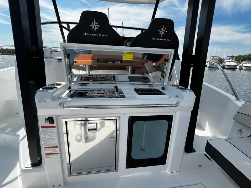 Slide: The Image of 2025 Jeanneau Leader 9.0 WA boat interior with modern kitchen amenities. - 36