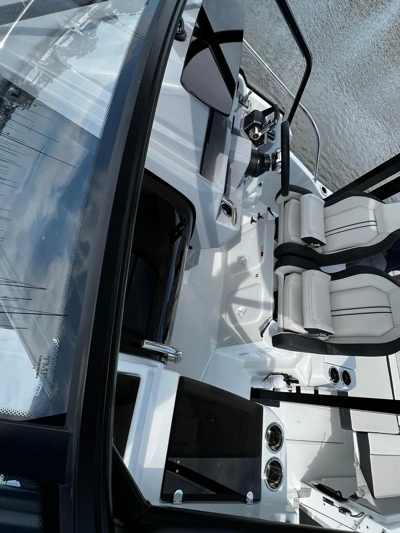 Slide: The Image of 2025 Jeanneau Leader 9.0 WA boat interior with modern seating and controls. - 45