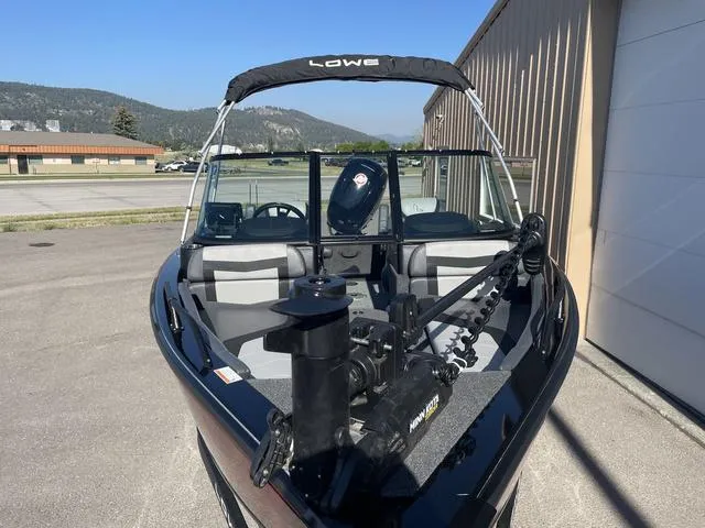 Slide: The Image of 2022 Lowe FS18 boat with canopy and trolling motor in outdoor setting. - 5