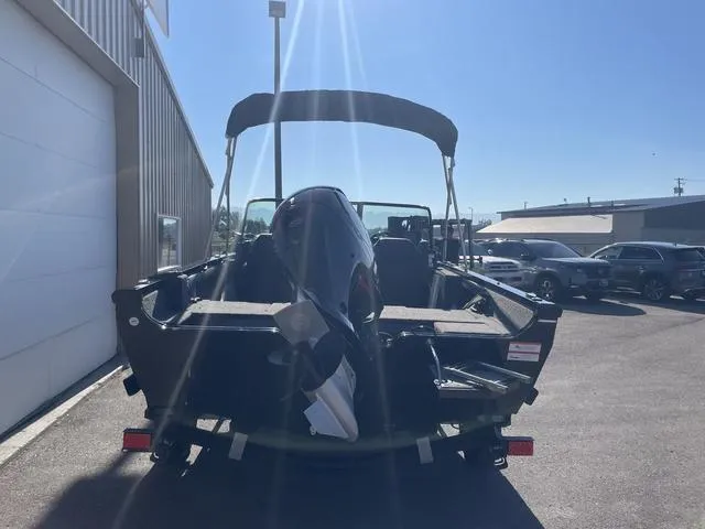 Slide: The Image of 2022 Lowe FS18 boat with outboard motor in parking lot. - 6