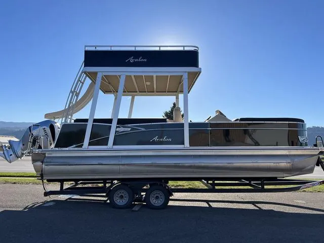 Slide: The Image of 2023 Avalon Catalina Entertainer Funship 25 FT pontoon boat on trailer. - 1